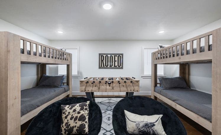 Bunk beds and foosball table in the game room area