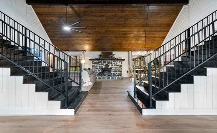 Great room fireplace and vaulted wood ceiling view